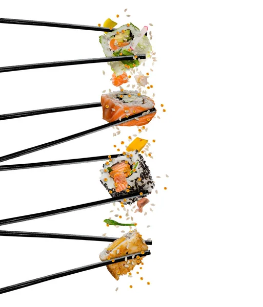 Kawałków sushi z drewniane pałeczki, oddzielone na liczby biały — Zdjęcie stockowe