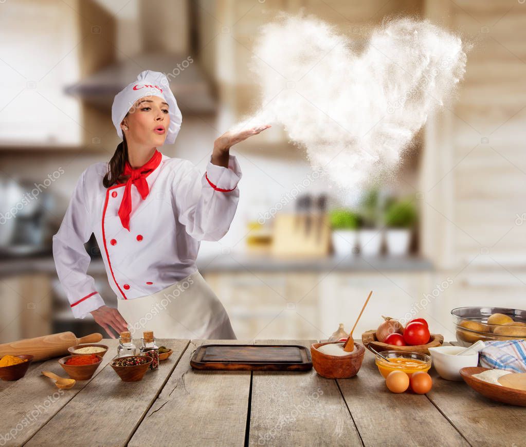 Young woman as chef in kitchen, concept of food preaparation