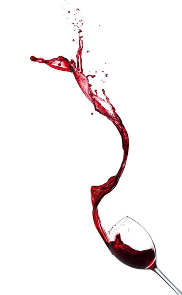Красное вино брызги из стекла на белом фоне — стоковое фото