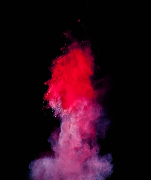 Explosão de pó colorido abstrato isolado no fundo preto . — Fotografia de Stock