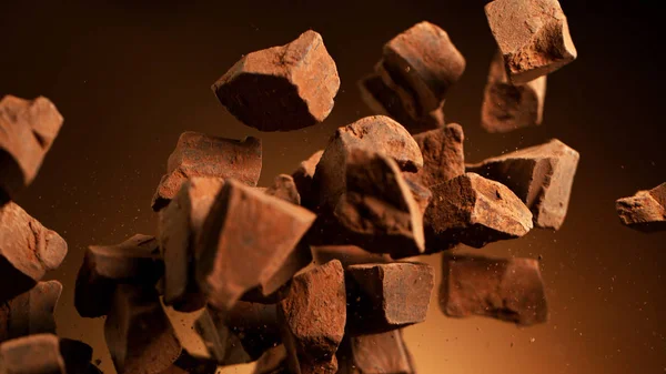 Flygande bitar av krossade chokladbitar — Stockfoto