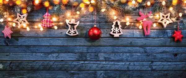 Christmas background with wooden decorations and spot lights. — Stock Photo, Image