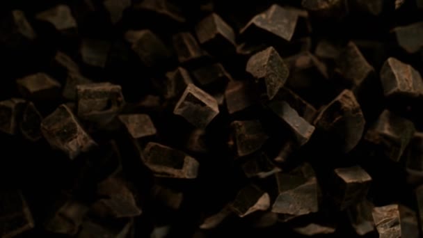 Super Slow Motion Flying Group Raw Chocolate Pieces Filmed High — Stock Video