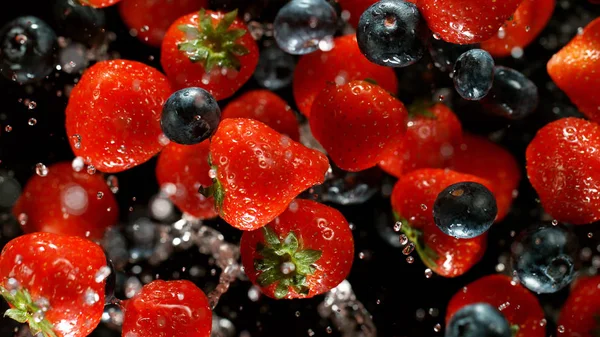 Freeze motion of flying group of berries fruit — Stock Photo, Image