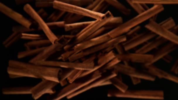 Super Slow Motion Flying Whole Cinnamon Bark Spice Filmed High — Stock Video