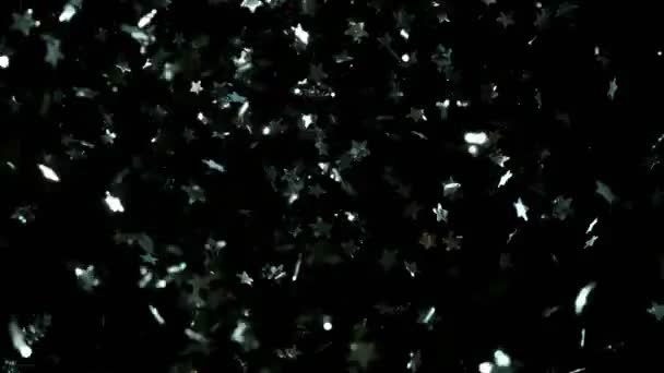 Superzeitlupe Fliegender Silberner Konfetti Sterne Auf Schwarzem Hintergrund Gedreht Mit — Stockvideo
