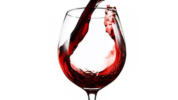 Detail of pouring red wine into glass on white — Stock Photo, Image