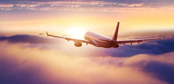 Passengers commercial airplane flying above clouds