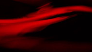 Makro çekimde kırmızı şarap sallamanın süper yavaş çekimi. Yüksek hızlı sinema kamerası, 1000 fps.