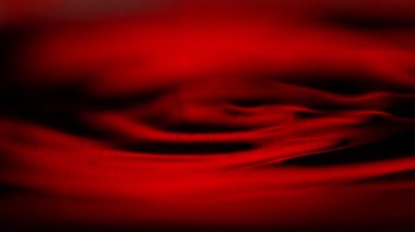 Makro çekimde kırmızı şarap sallamanın süper yavaş çekimi. Yüksek hızlı sinema kamerası, 1000 fps.