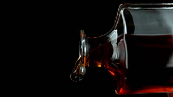 Super Slow Motion Pouring Whiskey Rum Closeup Detail Black Background — Stock Video