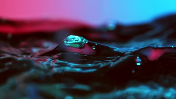 Super Slow Motion Splashing Water Wave Illuminated Neon Lights Filmed — Stock Video