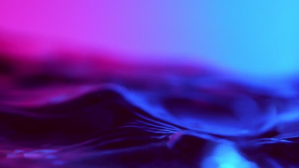 Super Slow Motion Splashing Water Wave Illuminated Neon Lights Filmed — Stock Video