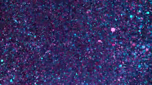 Mouvement super lent de particules dorées scintillantes sur fond noir. Faible profondeur de mise au point. Filmé sur caméra de cinéma à grande vitesse, 1000 images par seconde.