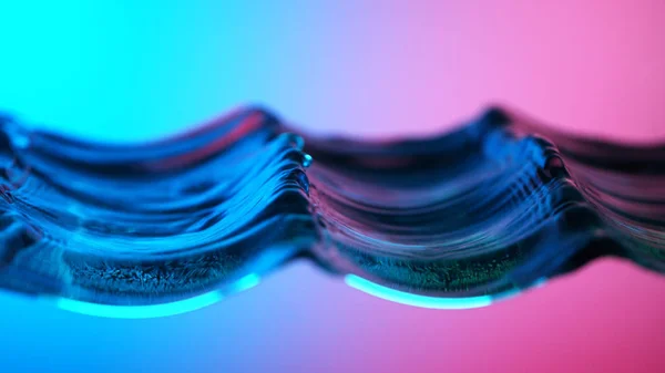 Detail of water waves in neon lights — ストック写真