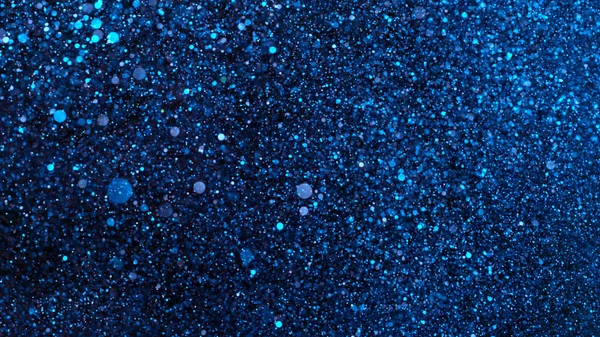 Abstract blue glittering background