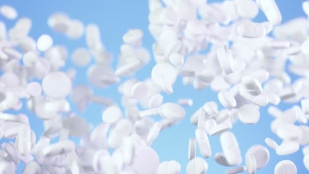 Super Slow Motion Falling White Pills Blue Background Filmed High — 비디오