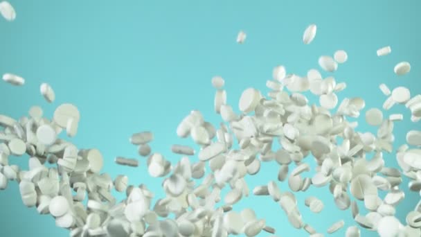 Superzeitlupe Fallender Weißer Pillen Auf Blauem Hintergrund Gefilmt Mit High — Stockvideo