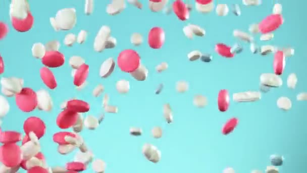 Super Slow Motion Falling White Pills Blue Background Filmed High — Stock Video