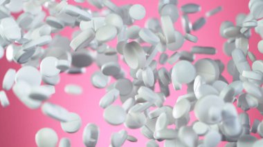 Pembe arka planda uçan hapların hareketlerini dondur