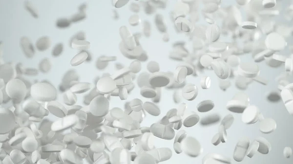 Frysebevegelse av hvite piller på hvit bakgrunn . – stockfoto