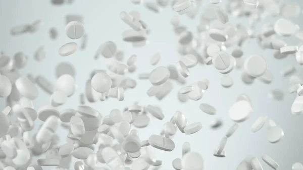 Freeze motion of white pills on white background. — Stock Photo, Image