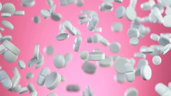 Freeze motion of flying pills on pink background — Stock Photo, Image