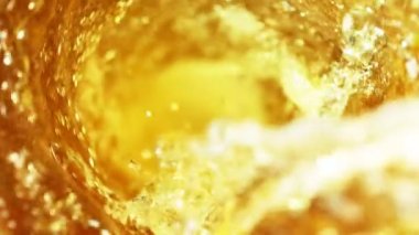 Super slow motion of pouring cola/whiskey or ice tea drink in twister shape. Filmed on high speed cinema camera, 1000 fps.