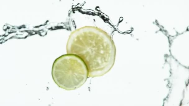 Super Slow Motion Lime Lemon Slices Water Splash White Background — Stock Video