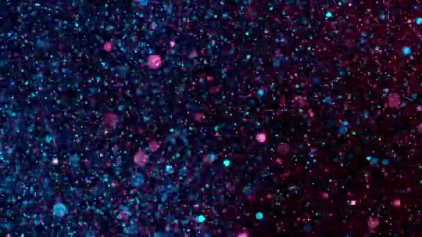 在黑色背景上闪光的彩色粒子的超慢速运动 聚焦深度较小 用高速摄像机拍摄 每秒1000帧 — 图库视频影像