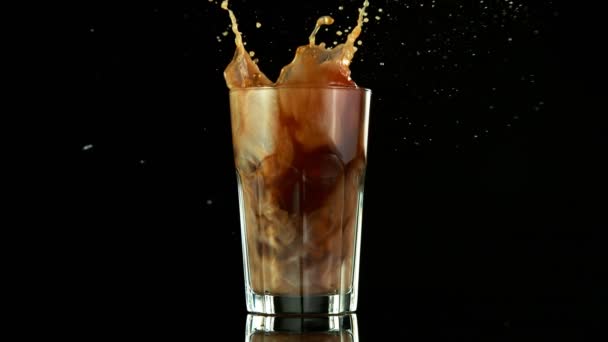 Super Slow Motion Falling Ice Cube Ice Coffee Drink Filmed — Stock Video