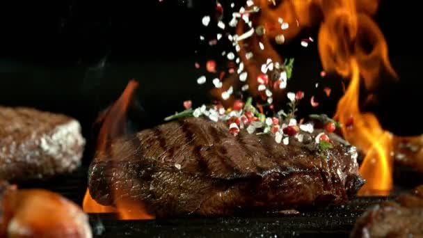 Super Slow Motion Beef Steak Grill Falling Spices Black Background — Stock Video