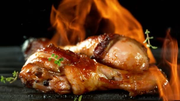 Super Slow Motion Chicken Legs Grill Fire Black Background Filmed — Stock Video