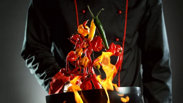 Closeup Chef Throwing Chilli Peppers Mix Wok Pan Fire Fresh — Stock Photo, Image