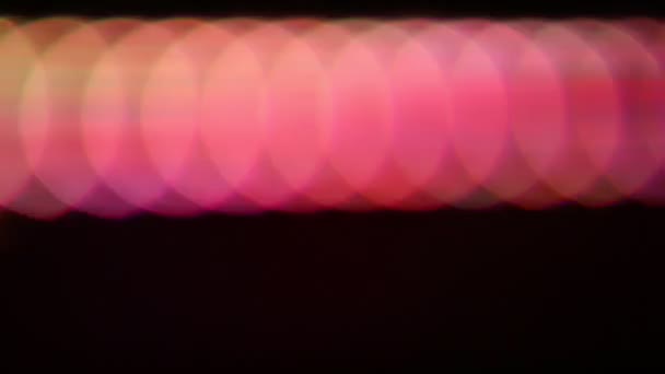 Close up shot of dancing LED lights blured out. Bokeh real — Vídeo de Stock
