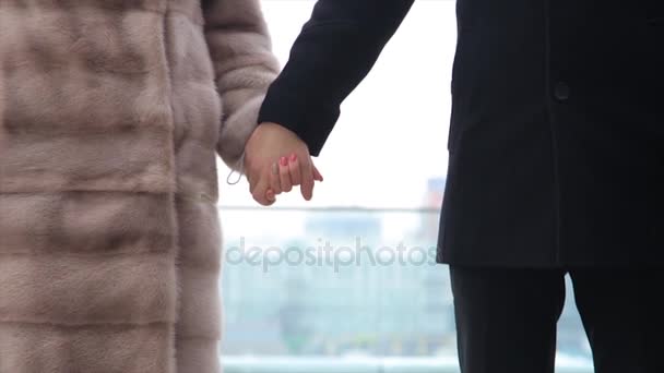 Romantic young people and love, man and woman as male and female college students walking and holding hands in city. — Stock Video