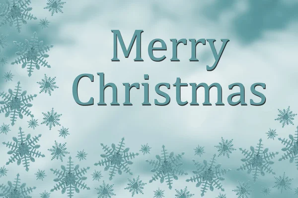 Рождественское послание на фоне синего снежка — стоковое фото