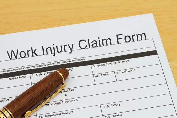 Filing a Work Injury Claim Form — Stock Photo, Image