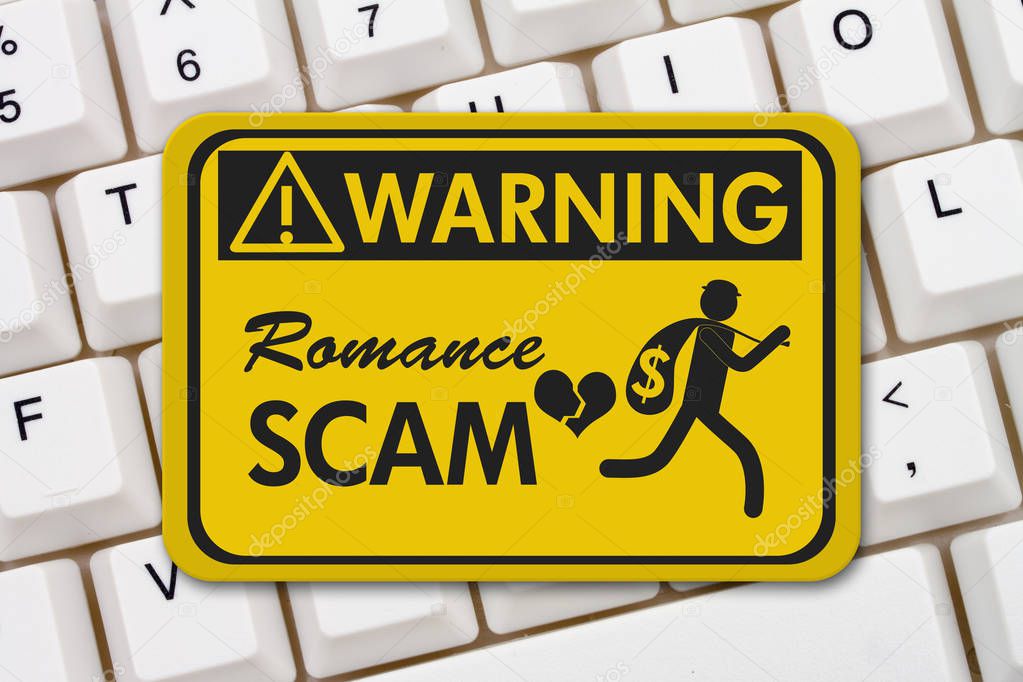Romance Scam warning sign on a keyboard