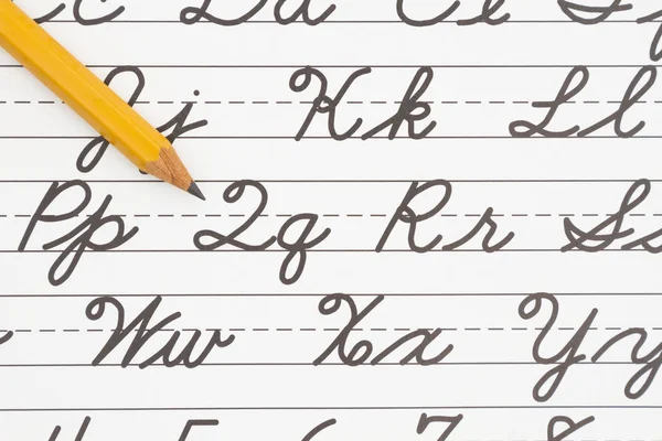 Learning to write cursive lettering — Stock Photo, Image