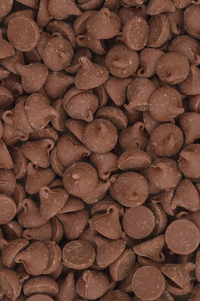Chocolate de leite escuro chips fundo — Fotografia de Stock