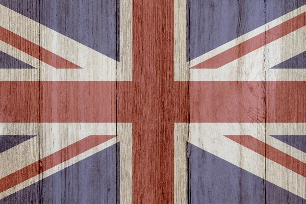 A rustic old British flag on weathered wood — Stock Photo, Image