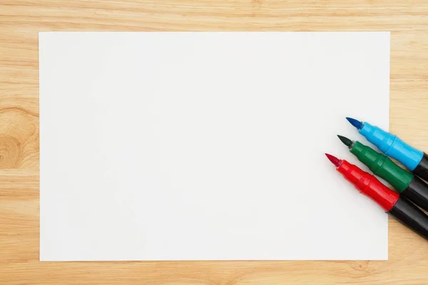 A red, green and blue watercolor brush marker with watercolor pa — Stock Photo, Image