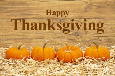 Saman üstünde portakal kabaklarıyla Şükran Günü 'nüz kutlu olsun.