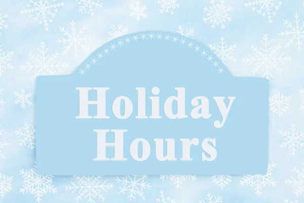 Holiday Hours message sign with a blue snowflakes — Stockfoto