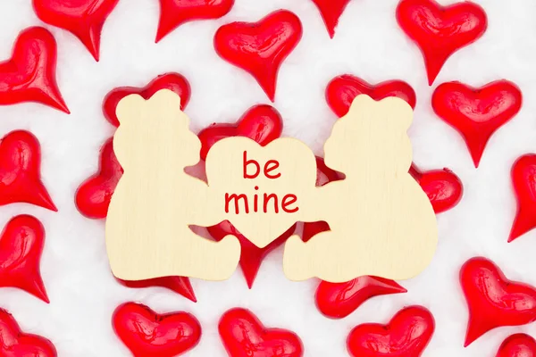 Be mine message on wood bear sign with red hearts on white fabri — Stock Photo, Image