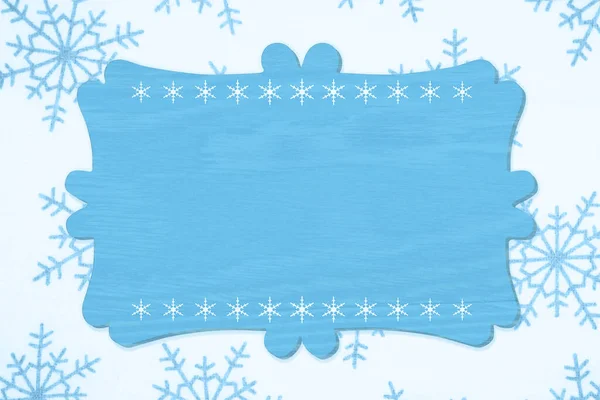 Blank wood sign with a blue snowflake background — 스톡 사진