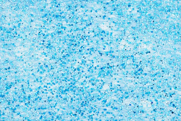 Kék és fehér texturált hatszög csillogás felett hópelyhek backgrou — Stock Fotó