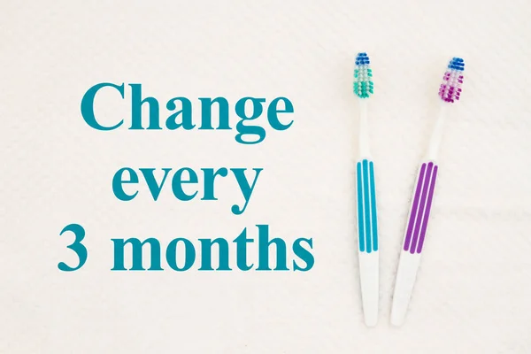 Change every 3 months text with toothbrushes — 스톡 사진