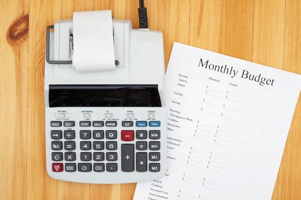 Creating your monthly budget with a vintage electric calculator — Stock Photo, Image